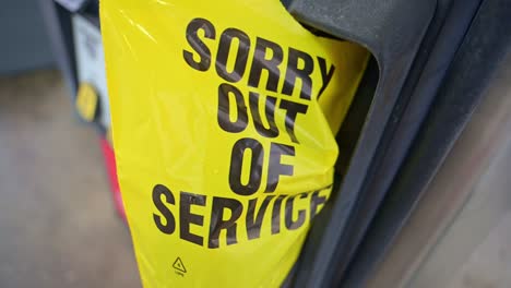 close-up of an out of service plastic bag on a fuel pump for gasoline