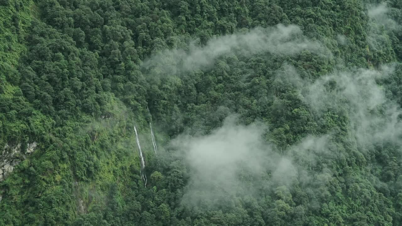 Aerial View of Waterfalls in Mountains Forest in Clouds, Beautiful Green Nature Shot of Elevated Aerial View of Waterfalls in Himalaya Mountains in Nepal in Lush Greenery Forest Scenery