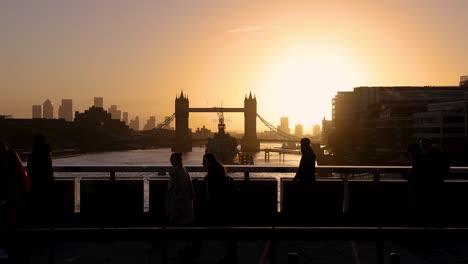 morning rush hour with people in silhouette going to work during sunrise