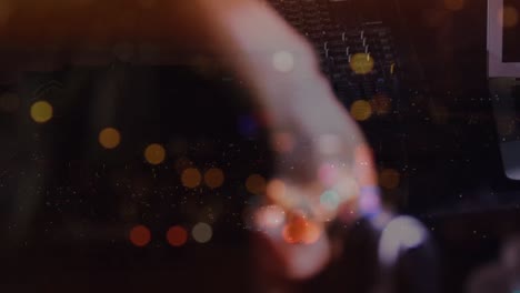 animation on blurred night road traffic over hands of caucasian dj on concert