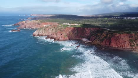 circle-with-the-drone-over-the-beautiful-bay-of-amado-in-south-portugal-,-sunny-weather