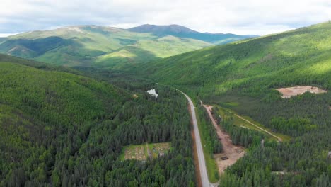 4k drone video of chena hot springs road at entrance of convention center and resort near fairbanks, alaska in summer