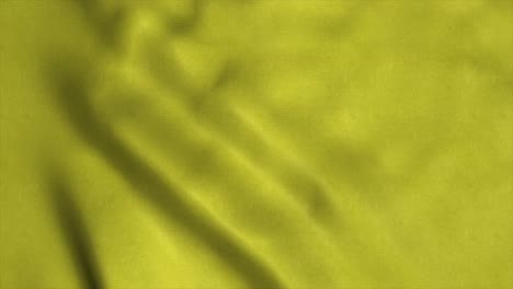la animación de la bandera dorada ondeando un bucle sin costuras. el video de la bandera de fondo amarillo ondeando en el viento