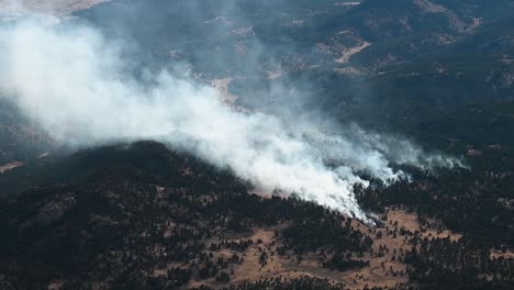 forest fires burning south of denver in the colorado rocky mountains, aerial