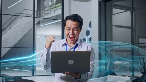 un hombre de negocios feliz celebrando el éxito con una computadora portátil.