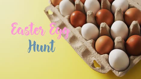 Animation-of-easter-egg-hunt-over-eggs-in-cardboard-over-yellow-background