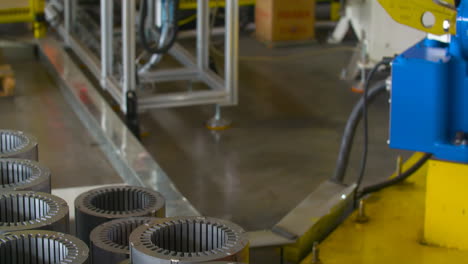 real shot assembly line inside automated robotic assembly machine of motor coil in a factory production process automobile manufacturing plant
