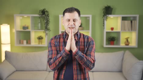 christian man praying at home. christian religious practices.