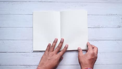 open notebook on wooden table