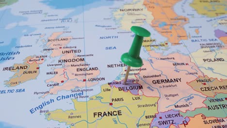 Belgium--Travel-concept-with-green-pushpin-on-the-world-map.-The-location-point-on-the-map-points-to-Brussels-the-capital-of-the-Belgium.