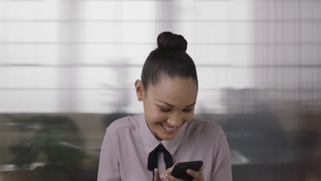 portrait-of-young-business-woman-intern-laughing-happy-enjoying-watching-funny-video-using-smartphone-online-social-media-in-office-workspace-background