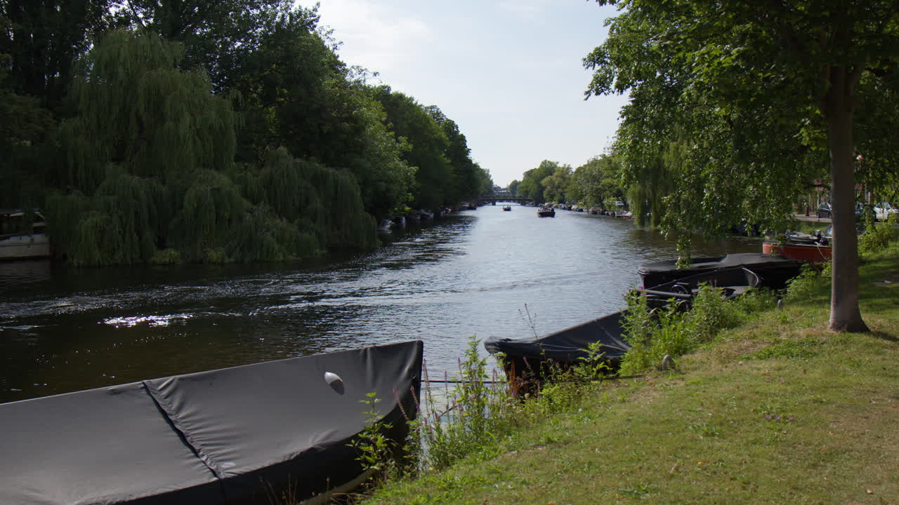 River In Amsterdam With Moored Boats, Approach Shot