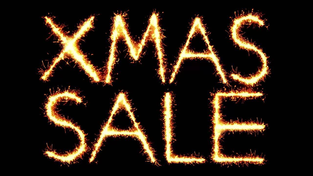 Xmas sale text sparkler writing with glitter sparks particles firework on black 4k loop background
