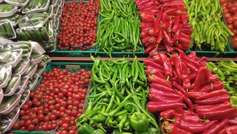 green and red capsicum displaying at shop