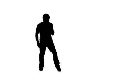 a silhouette man is dancing