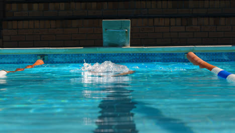 male swimmer swimming inside pool 4k