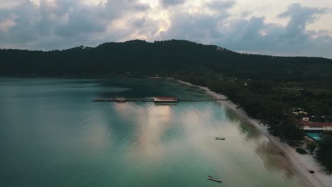 beautiful reflection of the clouds in the clear blue sea in the koh rong sanloem bay where a long pier has been built in cambodia