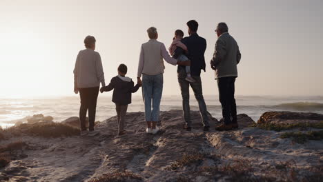 big family, holding hands or children at beach