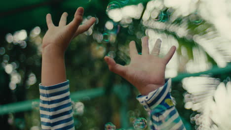 child playing with bubbles