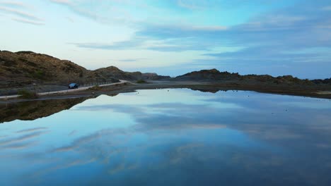 Dreamy-drone-flight-over-still-and-calm-waters-of-Menorca,-Spain