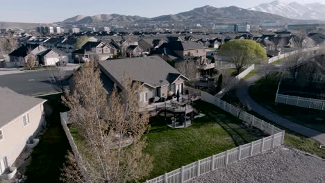 Backyard-outdoor-living-space---aerial-reveal-from-behind-a-tree