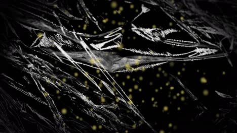 Animation-of-yellow-particles-floating-over-light-on-moving-shiny-black-plastic