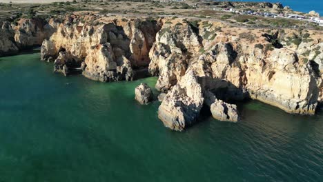 drone shot of rocky algarve coastline in southern portugal