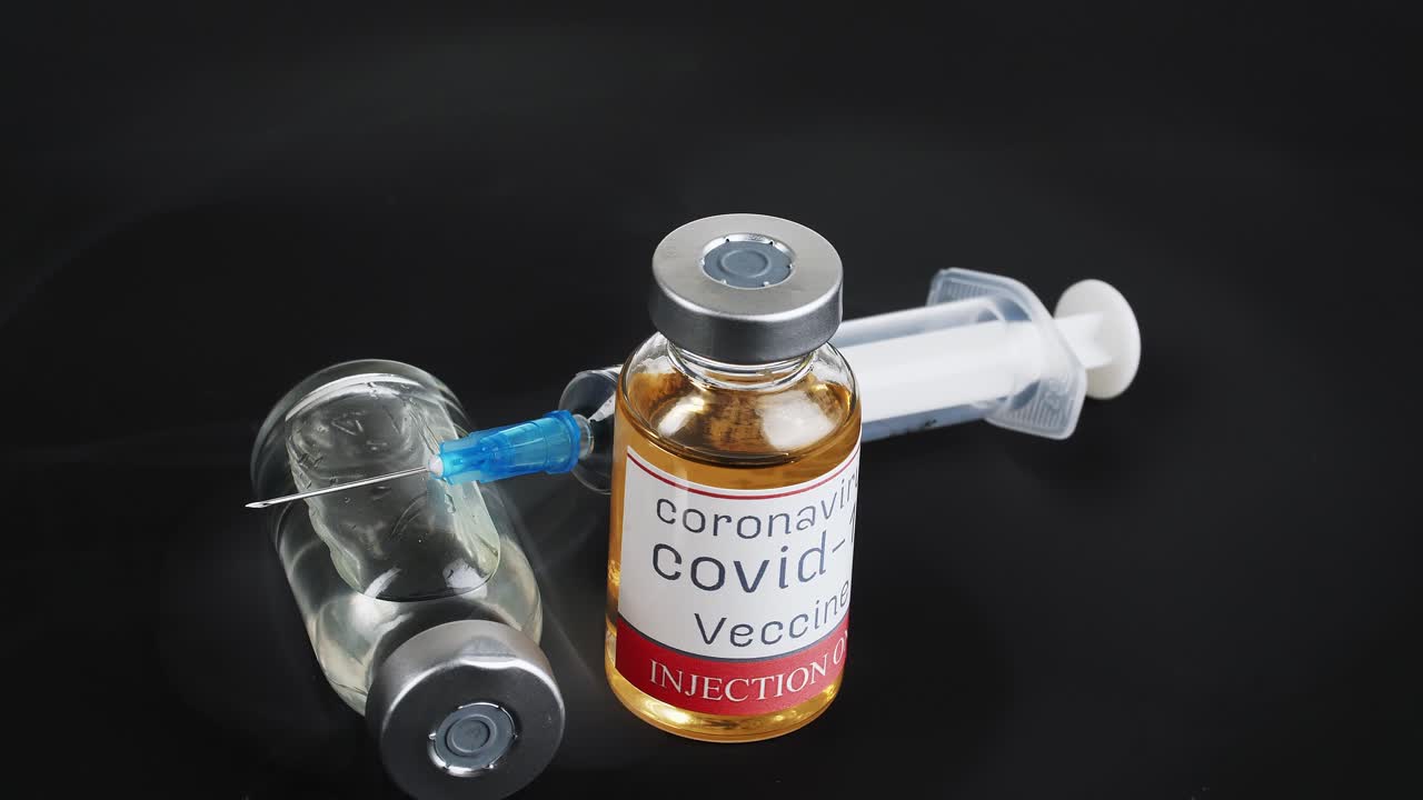 COVID-19 Vaccine and Syringe