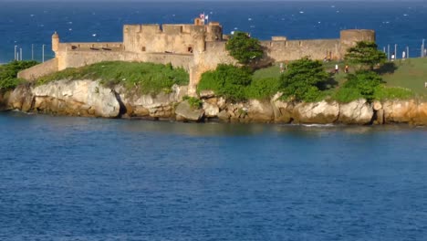 tourists visiting fort san felipe , taino bay, puerto plata, dominican republic