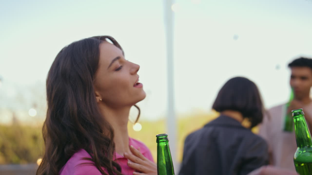 Partying couple talking terrace place close up. Relaxed man woman drinking beer