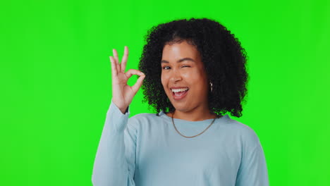 Portrait,-woman-with-hand-sign-for-ok-on-green