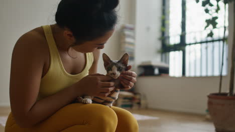 woman holding a kitten