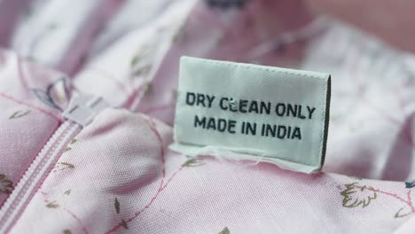 dry clean only label on pink dress