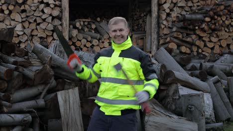 Crazy-lumberjack-dancing-with-small-axe-and-saw.-Man-woodcutter-celebrate.-Sawmill-background