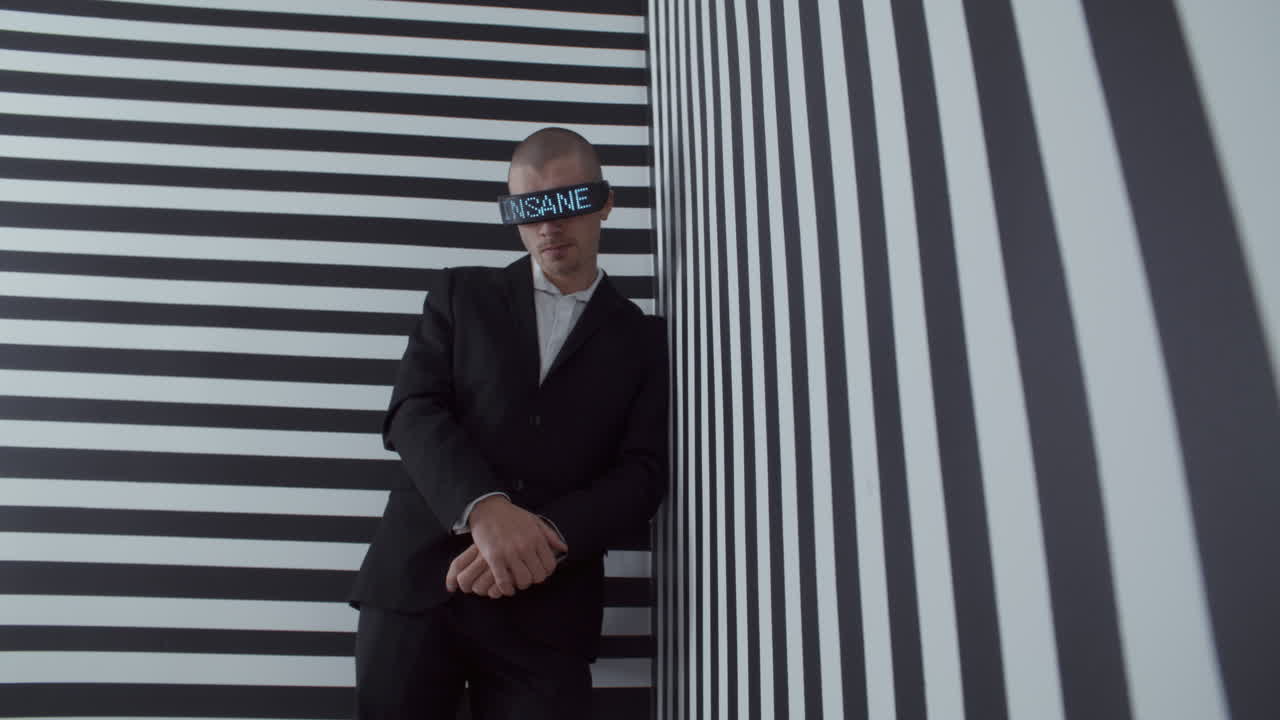Man Wearing VR Headset in Striped Room