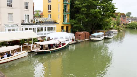 boats moving along a scenic canal