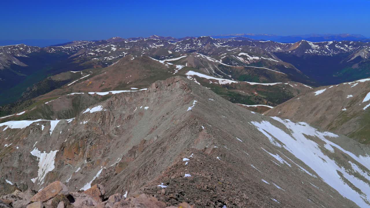 Top of summit 14er Mt Mount Princeton Sawatch Range Rocky Mountains Colorado landscape valley view summit hiking spring summer blue sky morning Huron La Plata peak snow fields melting static shot
