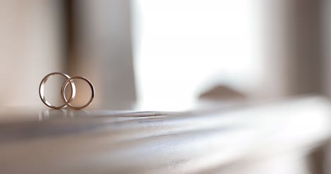 wedding rings on table wedding preparations 2