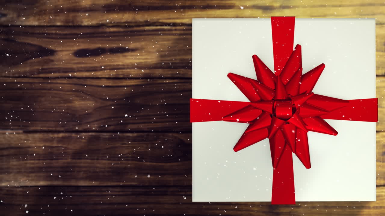 neve caindo com presente de natal