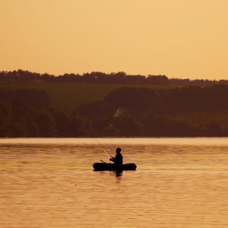 fisherman in a boat silhouette