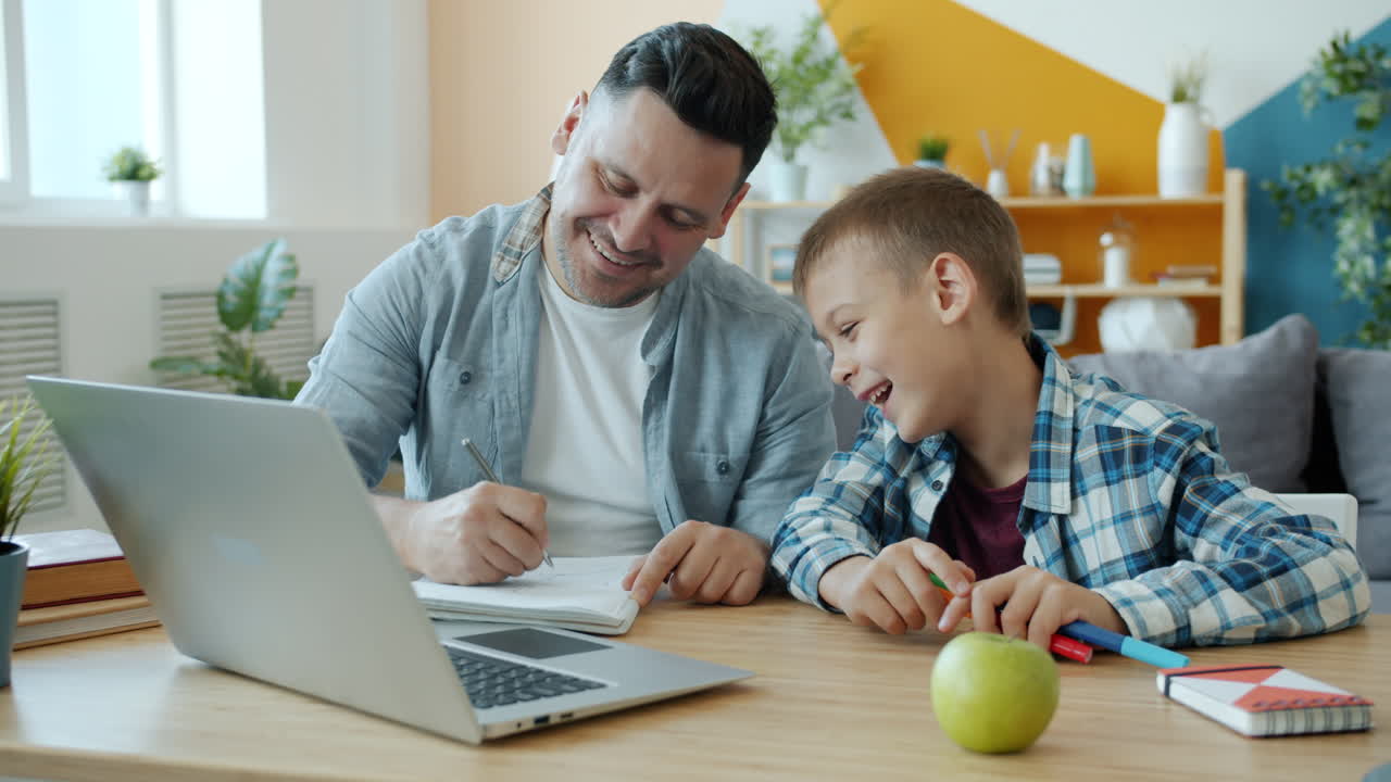 Father and Son Learning Together at Home
