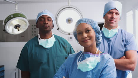 Portrait-Of-Multi-Cultural-Surgical-Team-Standing-In-Hospital-Operating-Theater