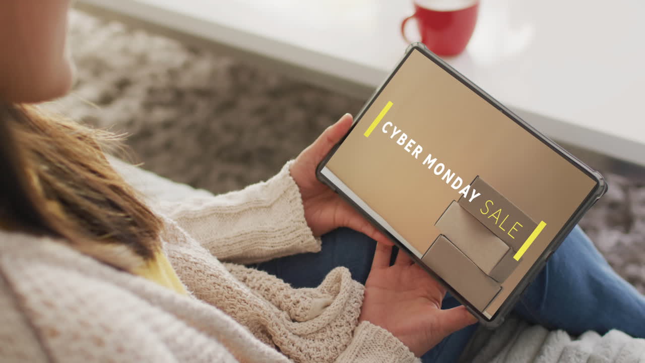 Caucasian woman using tablet at home for online shopping, slow motion