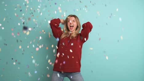 cheerful woman celebrating big win showered in confetti