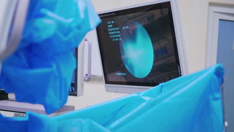 surgery in operation room. surgeons team working with monitoring of patient in surgical operating room