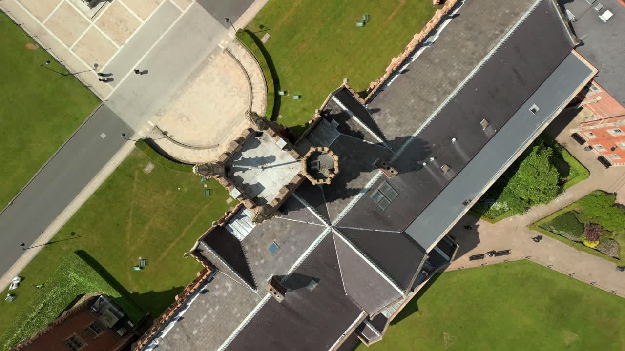 Overhead descending aerial video of Queen's University Belfast and campus on a bright and sunny day. Produced at 4K resolution, 60FPS and with Rec709 color.
