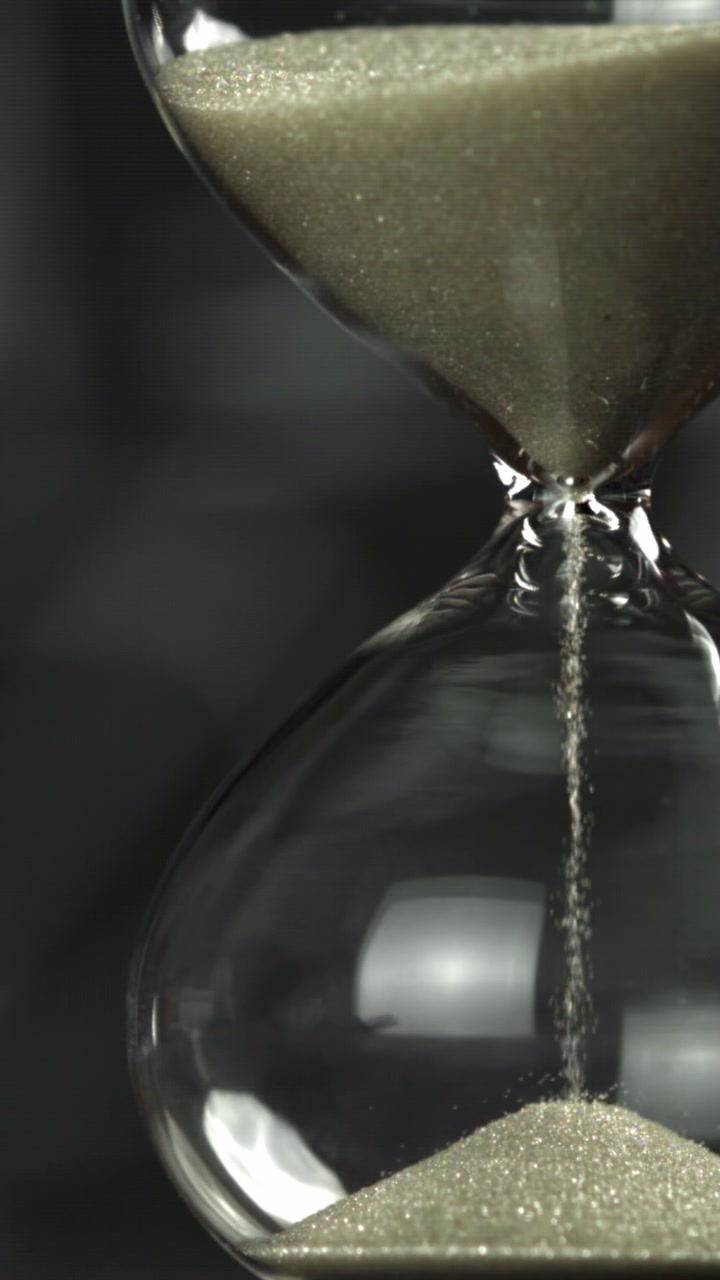 Time Passing as Sand Flows in a Classic Hourglass
