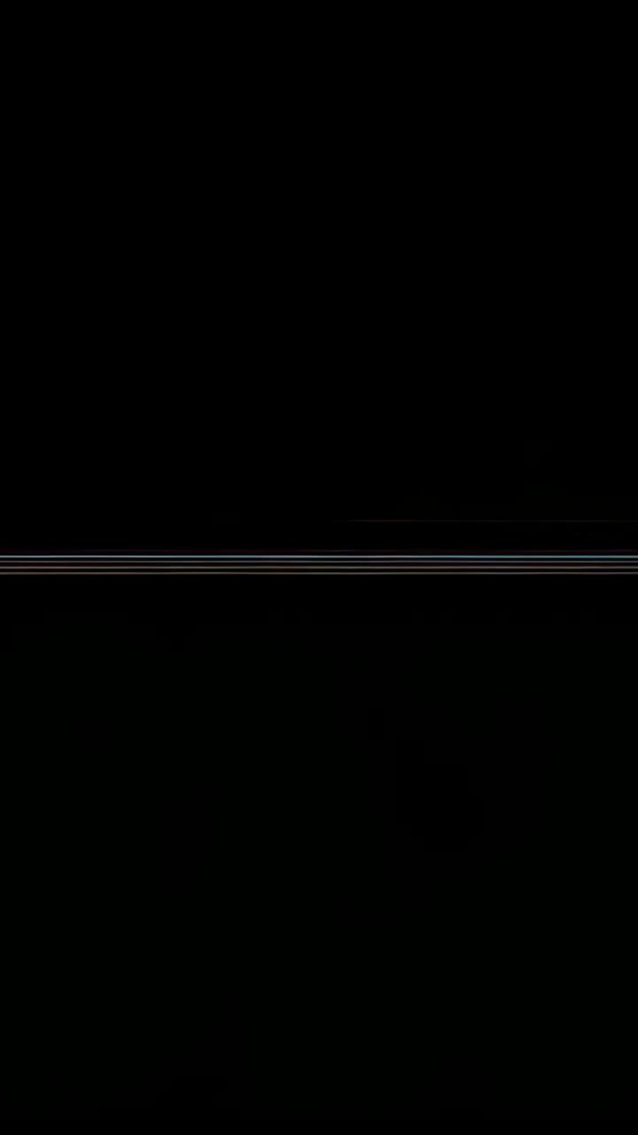 Vertical video: Starting black frame showing static stripe flickering in void, shifting brightness