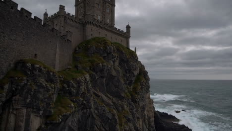 dramatic coastal castle on a rocky cliff