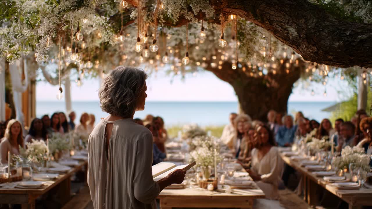 A picturesque outdoor gathering illuminated by hanging lights and adorned with flowers, where a speaker shares heartfelt moments amidst a serene natural backdrop, creating lasting memories